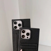 Two black Noir Card Square iPhone wallet cases showing pebbled texture and rear card holders