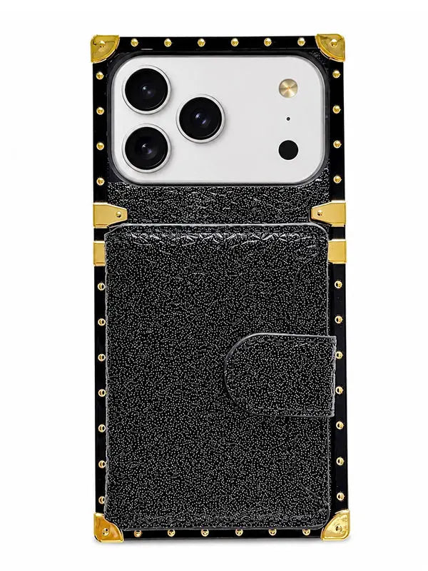 A black textured leather phone case with gold-tone metal studs and corner protectors, shown on a white phone against a plain white background.