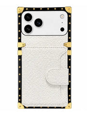A white textured faux-leather phone case with a card pocket, featuring a black border with gold-tone metal studs and corner protectors, shown on a white background.