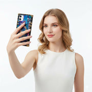 Woman holding a phone with a colorful case against a white background