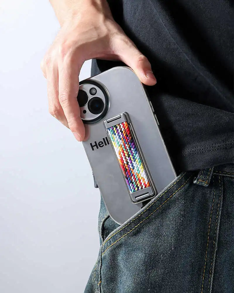 Person holding a phone with a colorful finger loop on back