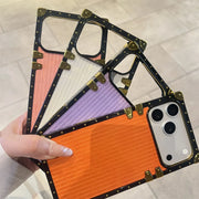 square trunk Phone case with geometric design held by a hand on a light background