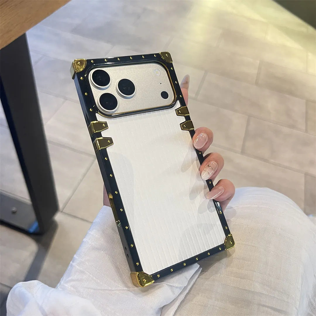 Phone case with decorative frame held by a person indoors