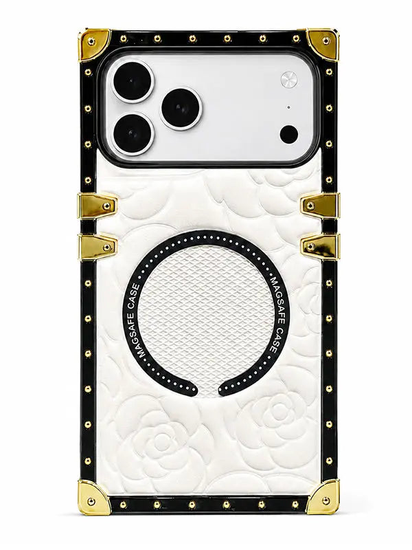 A luxury-style phone case featuring a white quilted rose pattern, a black horseshoe-shaped magnetic ring, and gold-tone metal corner protectors and rivets, shown on a white background.