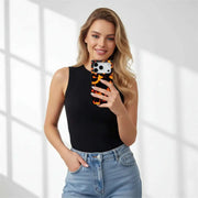 Woman holding a phone with a black case against a white background