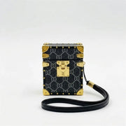 Designer AirPods trunk cover with gold accents on a white background