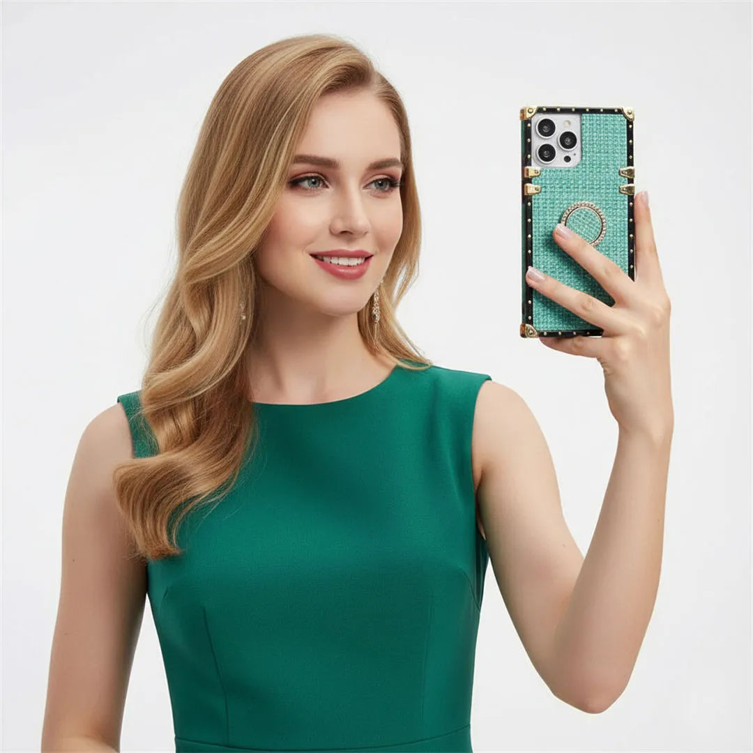 Woman in a green dress holding a phone with a green case against a light gray background