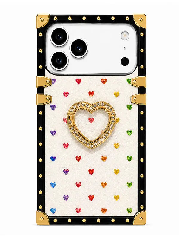 A protective phone case featuring a cream-colored textured back decorated with small colorful glitter hearts, a central gold heart with rhinestones, and a black border with gold corner guards and studs.