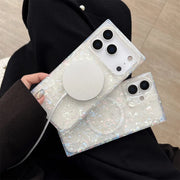 Person holding a phone case with a glittery finish
