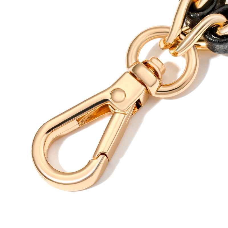 Gold carabiner on a white background