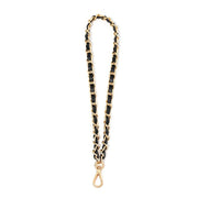 Black and gold chain strap on a white background